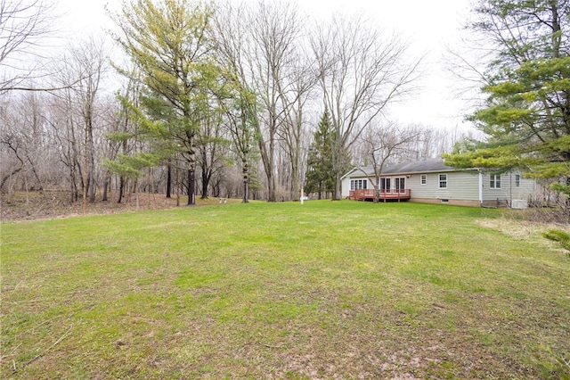 view of yard with a wooden deck