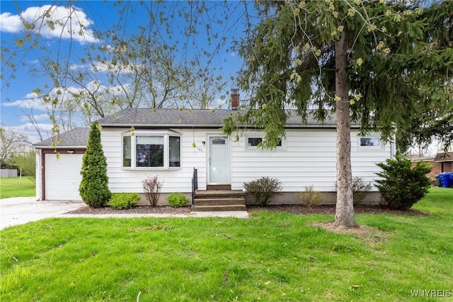 ranch-style home with a garage, a chimney, and a front yard