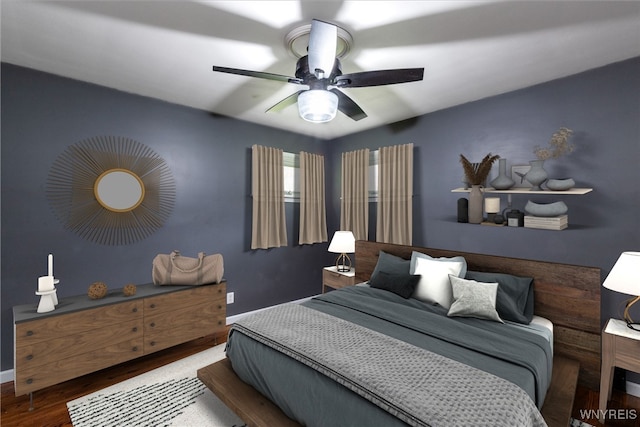 bedroom with baseboards, ceiling fan, and wood finished floors