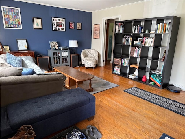 living room featuring ornamental molding and wood finished floors