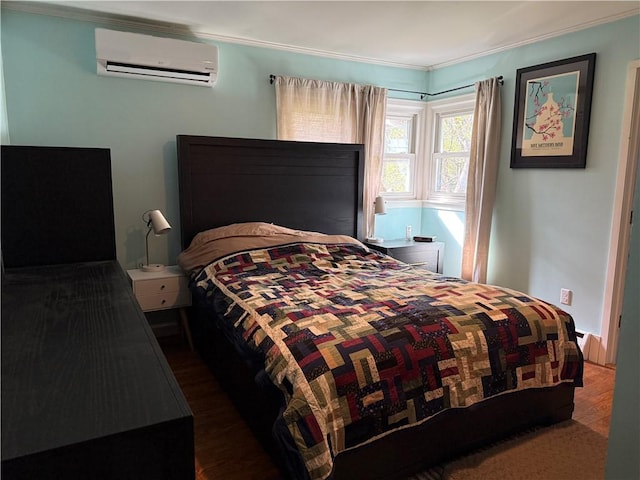 bedroom featuring a wall unit AC and ornamental molding