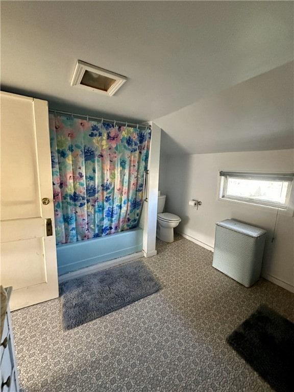 16 School St, Moravia, NY 13118 - full bath with shower / bath combo, vanity, toilet, baseboards, and lofted ceiling