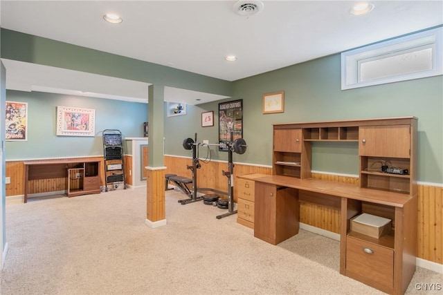 carpeted home office with wooden walls, wainscoting, recessed lighting, and visible vents