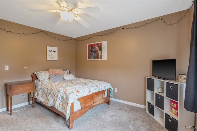 bedroom featuring a ceiling fan, baseboards, and carpet