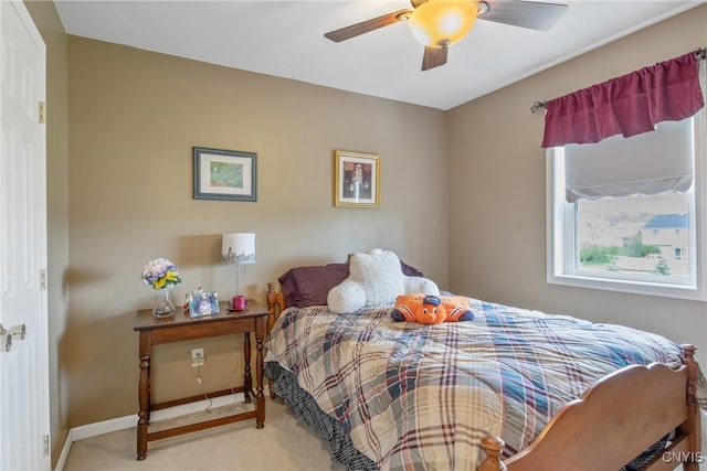 bedroom with baseboards, carpet, and a ceiling fan