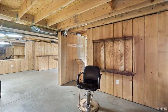 unfinished below grade area with wooden walls