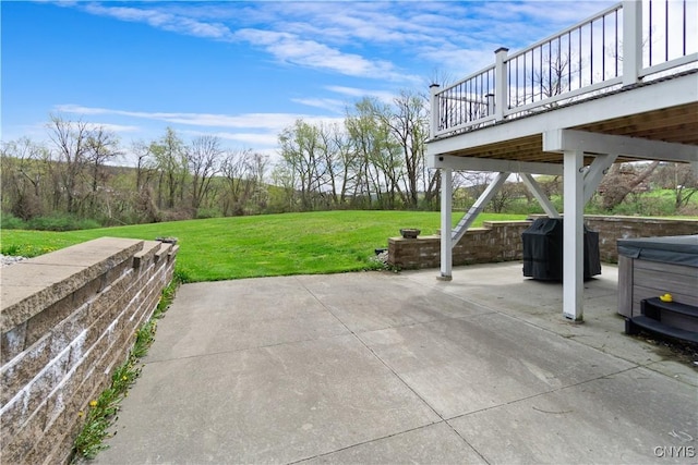 view of patio featuring a hot tub, grilling area, and a wooden deck