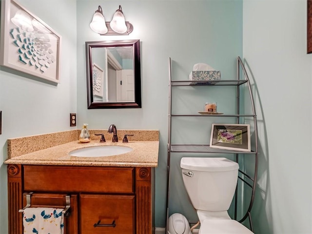 bathroom with toilet and vanity