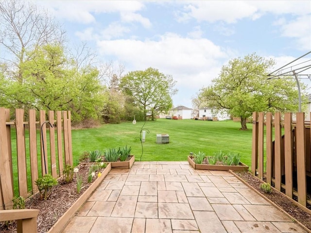 view of patio featuring fence
