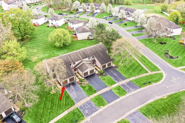 birds eye view of property with a residential view