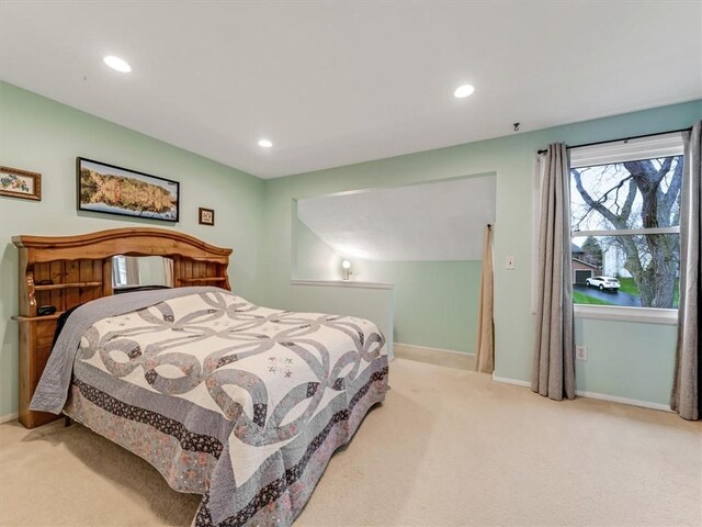 bedroom with baseboards, recessed lighting, and carpet