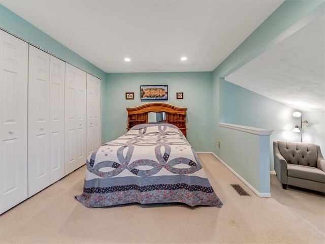 bedroom with visible vents, a closet, baseboards, recessed lighting, and carpet flooring