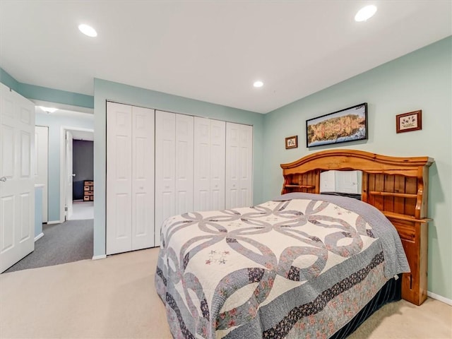 bedroom with recessed lighting, carpet, baseboards, and a closet