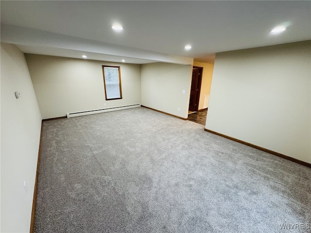 finished below grade area featuring carpet floors, recessed lighting, baseboards, and baseboard heating