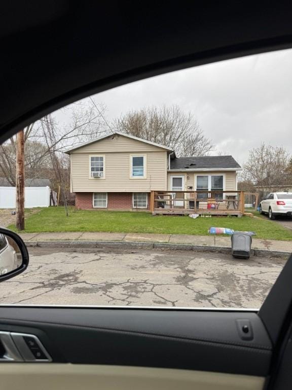 105 Parker Cir, Elmira-City, NY 14901 - split level home featuring fence, a wooden deck, and a front yard
