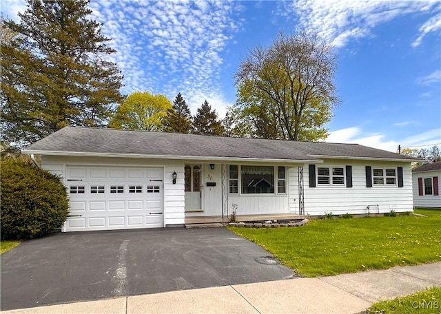 single story home with driveway, a front lawn, and a garage
