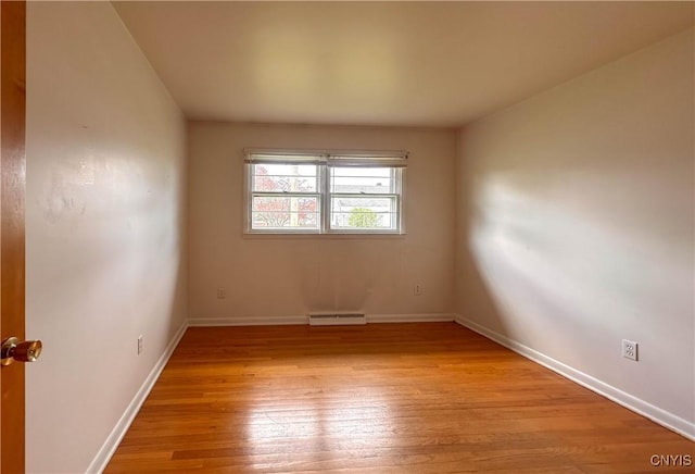 unfurnished room featuring baseboards, visible vents, and light wood-type flooring