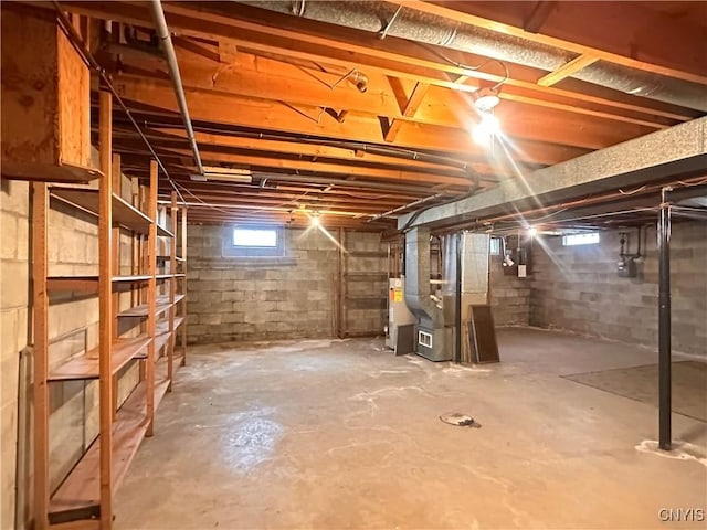 basement with heating unit and water heater