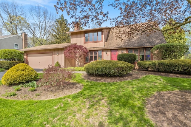 mid-century home featuring driveway, a front yard, and a garage