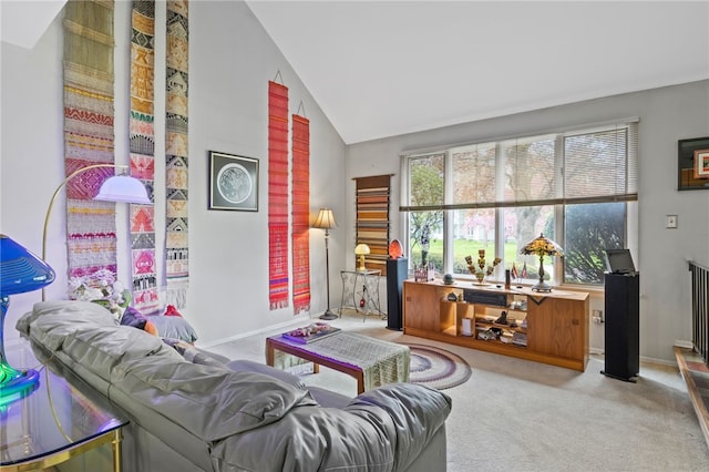 living room with carpet flooring, baseboards, and vaulted ceiling