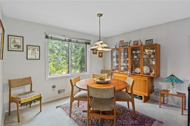dining area with visible vents, carpet flooring, and baseboards