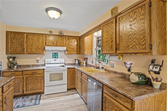 kitchen featuring brown cabinetry, white electric range oven, under cabinet range hood, a sink, and dishwasher
