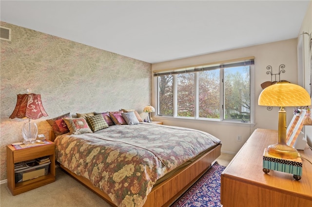 carpeted bedroom featuring baseboards