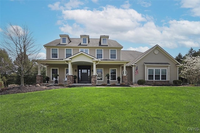 craftsman inspired home with covered porch and a front yard