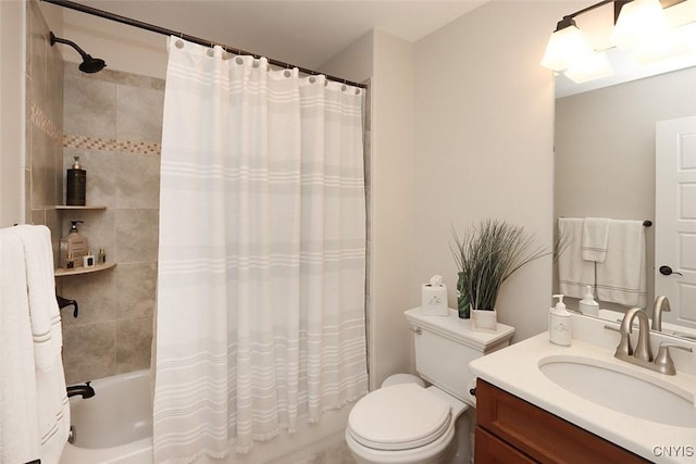 bathroom featuring vanity, toilet, and shower / tub combo