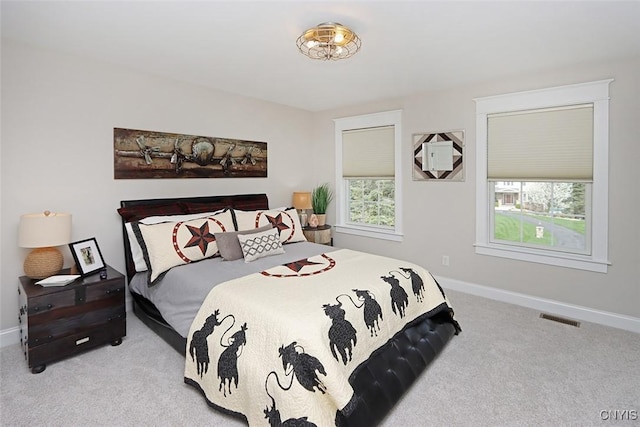 bedroom with visible vents, baseboards, and carpet floors