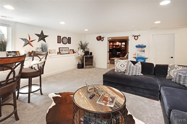 living area with carpet flooring, recessed lighting, and visible vents