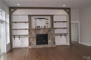 LOT16N Baltimore Ridge Rd, Marcellus, NY 13108 - unfurnished living room with baseboards, a stone fireplace, recessed lighting, and wood finished floors