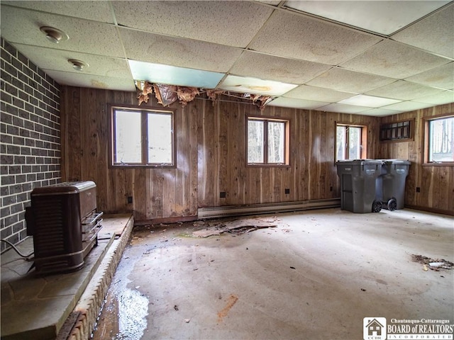 5585 Eke Rd, Harmony, NY 14710 - misc room featuring a paneled ceiling, a baseboard heating unit, a wealth of natural light, and wooden walls