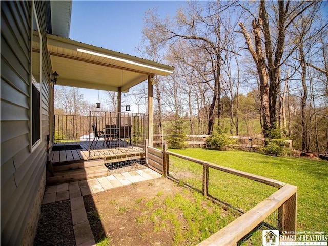 5585 Eke Rd, Harmony, NY 14710 - view of yard with fence, a wooden deck, and outdoor dining space