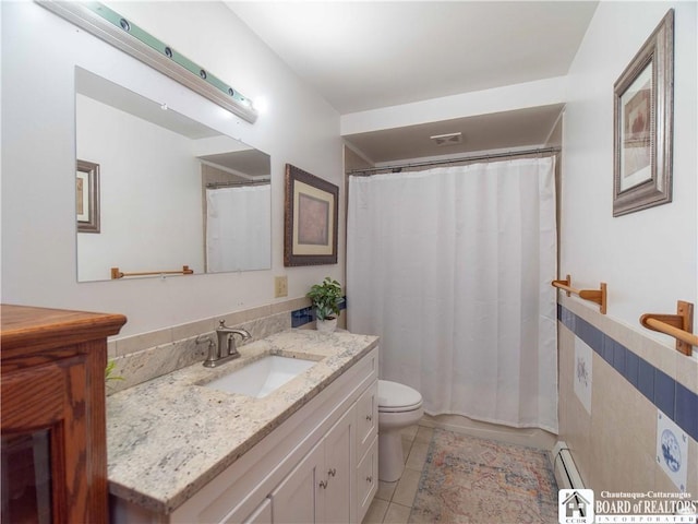5585 Eke Rd, Harmony, NY 14710 - bathroom with a baseboard radiator, vanity, tile patterned flooring, and toilet