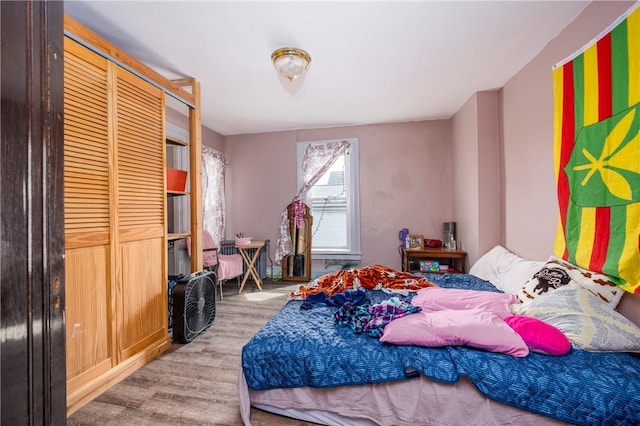 bedroom with wood finished floors