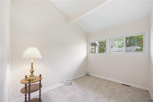 carpeted empty room with baseboards, lofted ceiling with beams, and visible vents