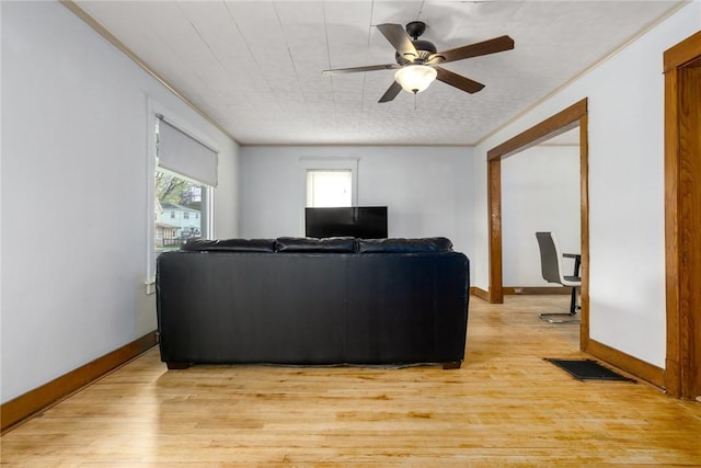 24 Sherman St, Union, NY 13790 - living room featuring crown molding, baseboards, a ceiling fan, and light wood finished floors