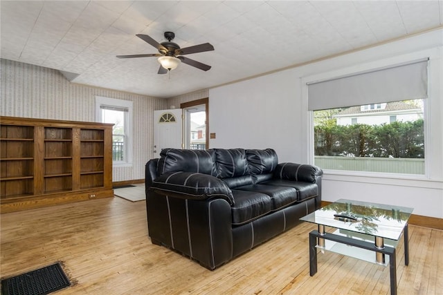 24 Sherman St, Union, NY 13790 - living room featuring ceiling fan, visible vents, wallpapered walls, and light wood-type flooring