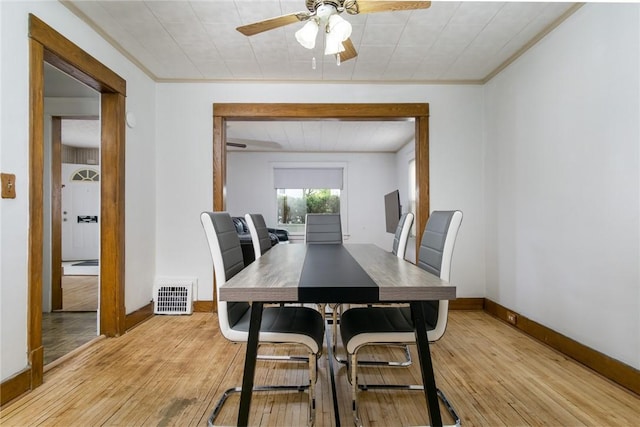24 Sherman St, Union, NY 13790 - dining area with a ceiling fan, visible vents, baseboards, light wood-style floors, and ornamental molding