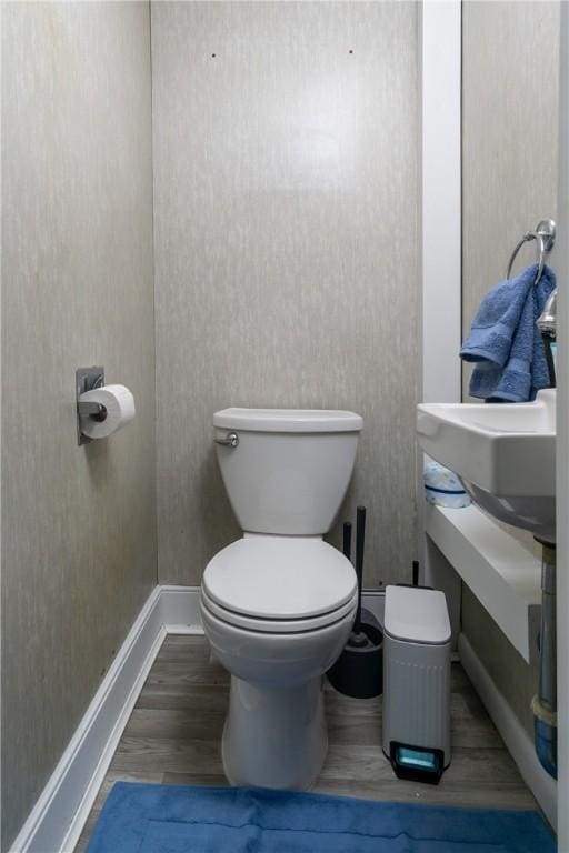 24 Sherman St, Union, NY 13790 - bathroom with baseboards, toilet, and wood finished floors