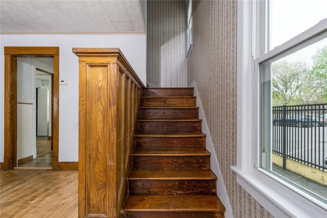 24 Sherman St, Union, NY 13790 - staircase with baseboards, wallpapered walls, wood finished floors, and a wealth of natural light