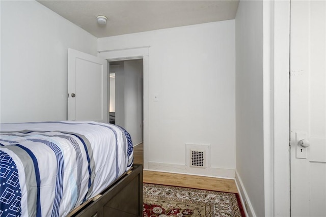 24 Sherman St, Union, NY 13790 - bedroom with visible vents, baseboards, and wood finished floors