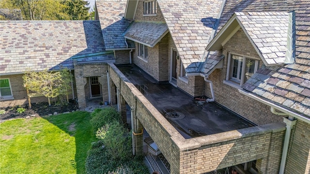 43 S Main St, Elba, NY 14058 - view of property exterior featuring a high end roof, a yard, and a chimney