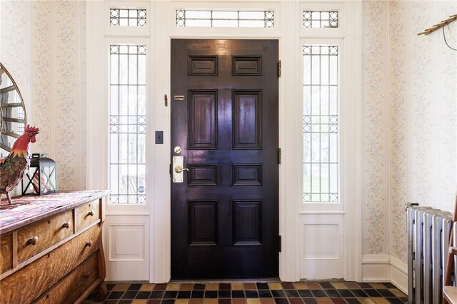 43 S Main St, Elba, NY 14058 - foyer with radiator and wallpapered walls