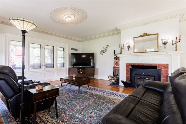 43 S Main St, Elba, NY 14058 - living area with a fireplace, crown molding, and wood finished floors