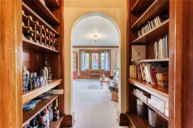 43 S Main St, Elba, NY 14058 - wine room featuring carpet floors, arched walkways, and crown molding
