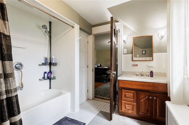 43 S Main St, Elba, NY 14058 - bathroom featuring vanity, shower / bath combo, and tile walls
