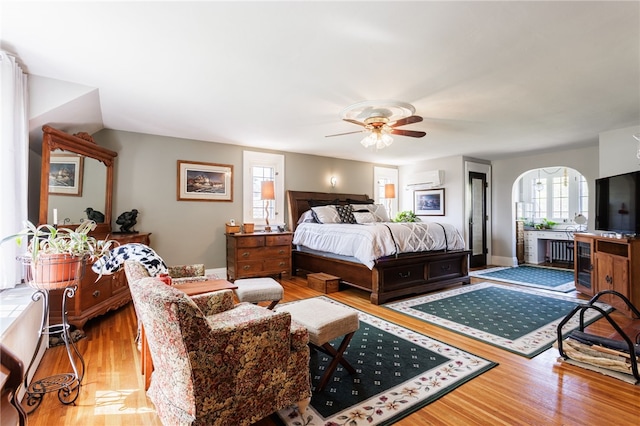 43 S Main St, Elba, NY 14058 - bedroom featuring wood finished floors, a wall mounted AC, and baseboards
