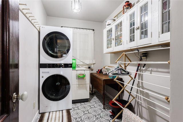 43 S Main St, Elba, NY 14058 - clothes washing area featuring stacked washing machine and dryer and tile patterned flooring